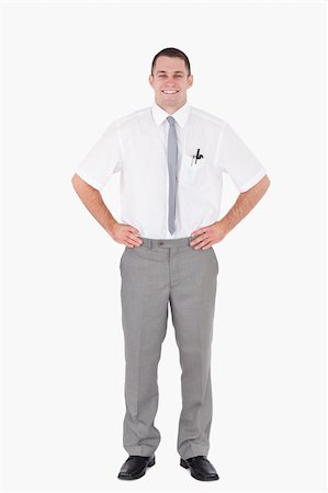 simsearch:400-07820348,k - Portrait of an office worker with the hands on his hips against a white background Photographie de stock - Aubaine LD & Abonnement, Code: 400-05715082