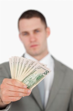 simsearch:400-05718322,k - Portrait of a businessman showing notes against a white background Fotografie stock - Microstock e Abbonamento, Codice: 400-05715206