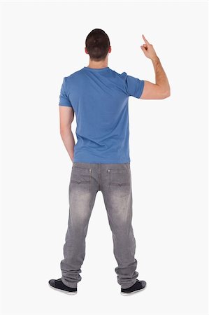 Portrait of a man pointing at something against a white background Stock Photo - Budget Royalty-Free & Subscription, Code: 400-05715217