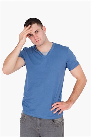 simsearch:400-04345508,k - Portrait of a man having a headache against a white background Stock Photo - Budget Royalty-Free & Subscription, Code: 400-05715260