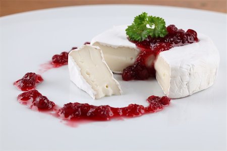 simsearch:400-06741554,k - Camembert with cranberry jam and parsley on white plate. Shallow dof Foto de stock - Royalty-Free Super Valor e Assinatura, Número: 400-05715386