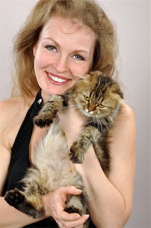 simsearch:400-06951515,k - happy smiling woman witha a Scottish fold-ear kitten Foto de stock - Super Valor sin royalties y Suscripción, Código: 400-05715529