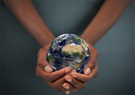 polluted globe - Feminine hands holding the Earth against a dark background Stock Photo - Budget Royalty-Free & Subscription, Code: 400-05716345