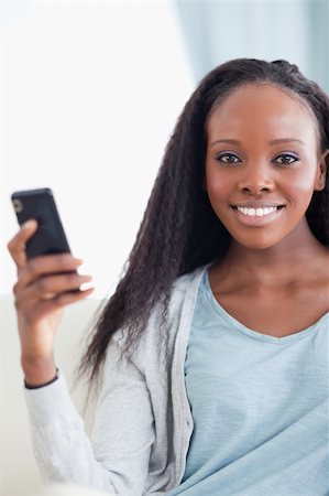 simsearch:400-05716936,k - Close up of smiling woman with smartphone Stock Photo - Budget Royalty-Free & Subscription, Code: 400-05716419