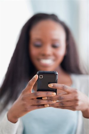 simsearch:400-05716936,k - Close up of smartphone being held by smiling woman Stock Photo - Budget Royalty-Free & Subscription, Code: 400-05716424