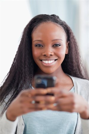 simsearch:400-05716936,k - Close up of smiling woman holding smartphone Stock Photo - Budget Royalty-Free & Subscription, Code: 400-05716425