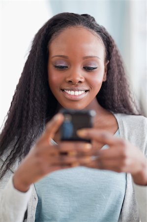 simsearch:400-05716936,k - Close up of happy smiling woman reading text message Stock Photo - Budget Royalty-Free & Subscription, Code: 400-05716423