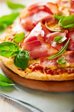 dry cured - pizza with dry cured ham flavored with basil Stock Photo - Budget Royalty-Free & Subscription, Code: 400-05716630