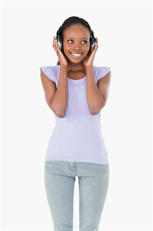 simsearch:400-05717354,k - Close up of young happy woman listening to music on white background Stock Photo - Budget Royalty-Free & Subscription, Code: 400-05717357