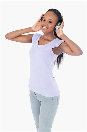 simsearch:400-05717354,k - Close up of smiling woman with headphones on white abckground Stock Photo - Budget Royalty-Free & Subscription, Code: 400-05717352