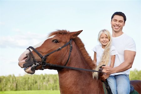 simsearch:400-04660370,k - Little girl with her father on a horse Photographie de stock - Aubaine LD & Abonnement, Code: 400-05717402