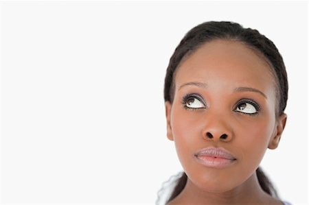 eye background for banner - Close up of young woman's face looking upwards diagonally on white background Stock Photo - Budget Royalty-Free & Subscription, Code: 400-05717445