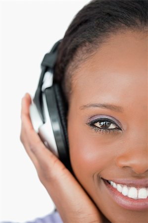 simsearch:400-05717354,k - Close up of young smiling woman with headphones on white background Stock Photo - Budget Royalty-Free & Subscription, Code: 400-05717450