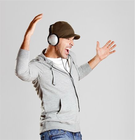 Portrait of a happy young man listen music with headphones Stock Photo - Budget Royalty-Free & Subscription, Code: 400-05717503