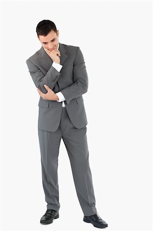 simsearch:400-03916433,k - Businessman looking on the floor while thinking against a white background Foto de stock - Super Valor sin royalties y Suscripción, Código: 400-05718083