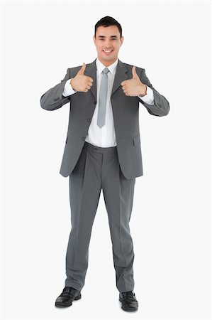 simsearch:400-05718341,k - Smiling businessman giving thumbs up against a white background Stock Photo - Budget Royalty-Free & Subscription, Code: 400-05718092