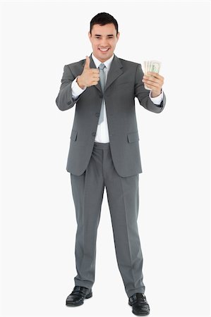 simsearch:400-05718322,k - Businessman with banknotes giving thumb up against white background Fotografie stock - Microstock e Abbonamento, Codice: 400-05718110