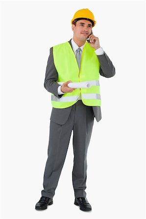 Architect listening to caller against a white background Photographie de stock - Aubaine LD & Abonnement, Code: 400-05718130