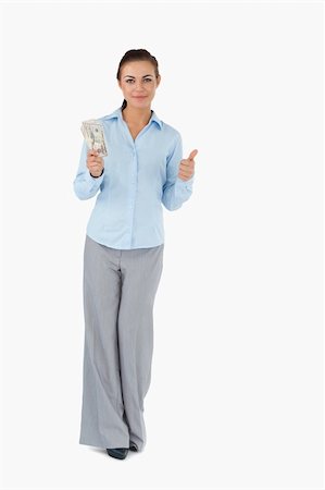 Businesswoman with banknotes giving thumb up against a white background Stock Photo - Budget Royalty-Free & Subscription, Code: 400-05718155