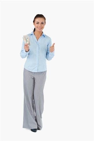 Smiling businesswoman with banknotes giving thumb up Stock Photo - Budget Royalty-Free & Subscription, Code: 400-05718156