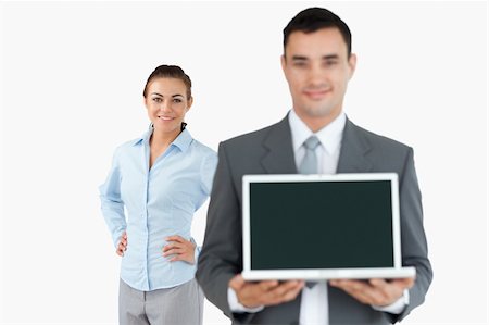 simsearch:400-04918393,k - Business partner presenting laptop against a white background Stock Photo - Budget Royalty-Free & Subscription, Code: 400-05718170