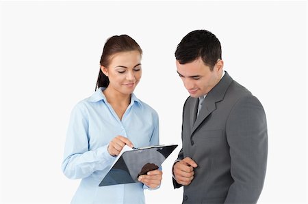 simsearch:400-08196033,k - Businesswoman showing data to her partner against a white background Stock Photo - Budget Royalty-Free & Subscription, Code: 400-05718195