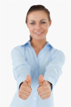 simsearch:400-05898224,k - Businesswoman giving both thumbs up against a white background Foto de stock - Royalty-Free Super Valor e Assinatura, Número: 400-05718258