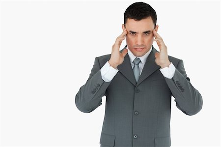 simsearch:400-03916433,k - Businessman suffering from a headache against a white background Foto de stock - Super Valor sin royalties y Suscripción, Código: 400-05718294