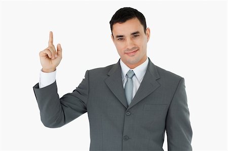 simsearch:400-05895521,k - Standing businessman pointing upwards against a white background Stock Photo - Budget Royalty-Free & Subscription, Code: 400-05718300