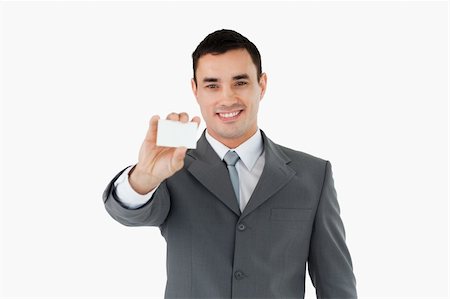 simsearch:400-05718318,k - Businessman showing his businesscard against a white background Foto de stock - Super Valor sin royalties y Suscripción, Código: 400-05718316