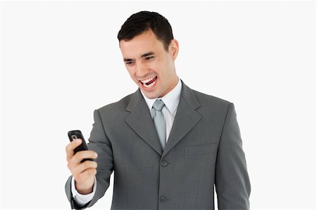 simsearch:400-04608943,k - Businessman happy about text message against a white background Stock Photo - Budget Royalty-Free & Subscription, Code: 400-05718312