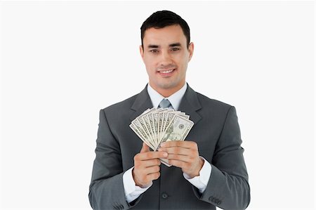 Businessman with bank notes against a white background Stock Photo - Budget Royalty-Free & Subscription, Code: 400-05718322