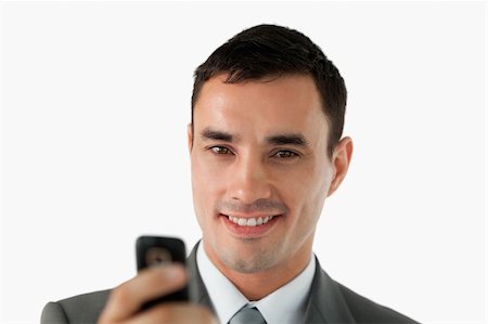 simsearch:400-05718346,k - Close up of businessman writing text message against a white background Foto de stock - Super Valor sin royalties y Suscripción, Código: 400-05718402