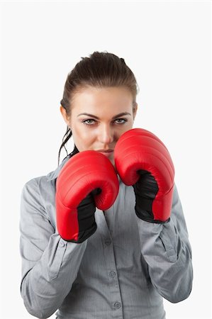 simsearch:400-05898249,k - Businesswoman with boxing gloves on against a white background Stock Photo - Budget Royalty-Free & Subscription, Code: 400-05718452