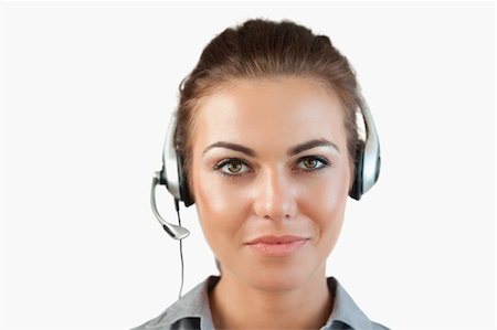 Close up of female call center agent against a white background Foto de stock - Super Valor sin royalties y Suscripción, Código: 400-05718518