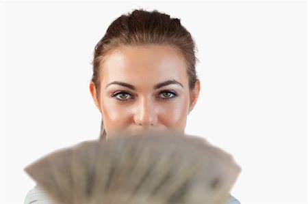 simsearch:400-05718322,k - Close up of businesswoman showing bank notes against a white background Fotografie stock - Microstock e Abbonamento, Codice: 400-05718530
