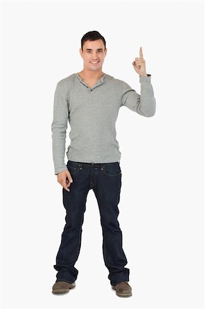 simsearch:400-05895521,k - Young male pointing upwards against a white background Stock Photo - Budget Royalty-Free & Subscription, Code: 400-05718548