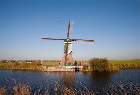 polder - Traditional Dutch windmill in Groot-Ammers, the Netherlands Stock Photo - Budget Royalty-Free & Subscription, Code: 400-05718775