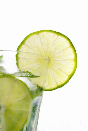 simsearch:400-07555096,k - Green mojito with a slice of lime isolated on white Stock Photo - Budget Royalty-Free & Subscription, Code: 400-05718909