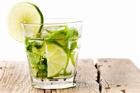 simsearch:400-07555096,k - Glass of mojito on a wooden table isolated on white Stock Photo - Budget Royalty-Free & Subscription, Code: 400-05718911