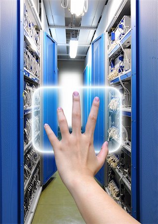 hand working on the communication and internet network server Stock Photo - Budget Royalty-Free & Subscription, Code: 400-05718997