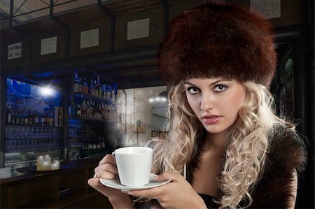 very attractive blond curly woman in elegant dress with fur stole and hat drinking a cup of tea Stock Photo - Budget Royalty-Free & Subscription, Code: 400-05719229