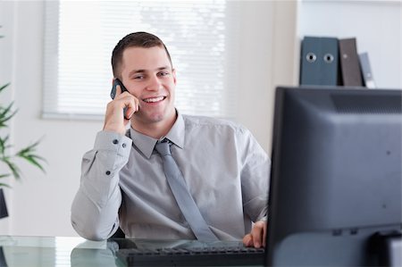 simsearch:400-05709706,k - Smiling happy businessman getting pleasant call Stock Photo - Budget Royalty-Free & Subscription, Code: 400-05710268