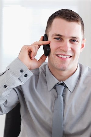 simsearch:400-05709706,k - Close up of smiling happy businessman getting good news on the phone Stock Photo - Budget Royalty-Free & Subscription, Code: 400-05710263