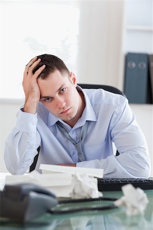 Close up of unhappy businessman being depressed by accounting Stock Photo - Budget Royalty-Free & Subscription, Code: 400-05710287