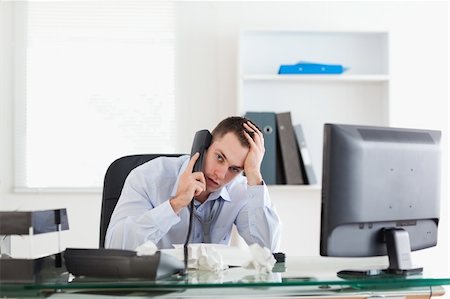 simsearch:400-05709706,k - Depressed businessman trying to solve a problem on the phone Stock Photo - Budget Royalty-Free & Subscription, Code: 400-05710297