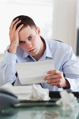 simsearch:400-08071323,k - Close up of young businessman worried about bills Foto de stock - Super Valor sin royalties y Suscripción, Código: 400-05710292