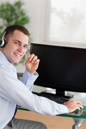 simsearch:400-05710310,k - Shadowing a friendly young call center agent Stock Photo - Budget Royalty-Free & Subscription, Code: 400-05710343