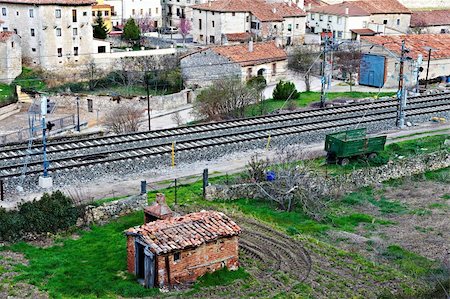 damaged roof - The Railroad Passes through the Medieval Spanish City Stock Photo - Budget Royalty-Free & Subscription, Code: 400-05710407