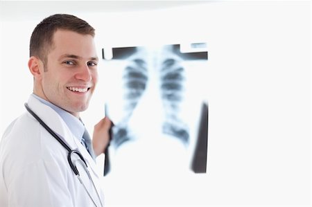 simsearch:400-05710928,k - Smiling doctor with x-ray image Stockbilder - Microstock & Abonnement, Bildnummer: 400-05710442